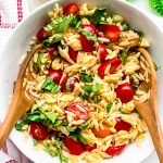 top view of orzo pasta salad with tomatoes and basil