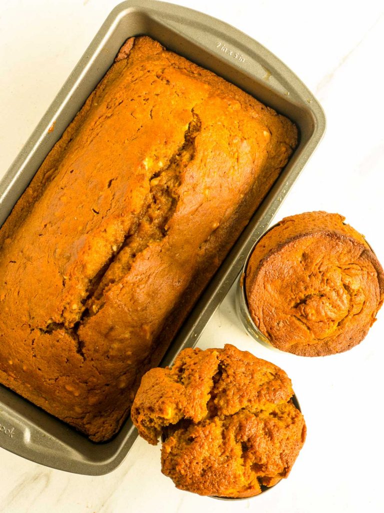 Baked pumpkin bread in loaf pan and soup can