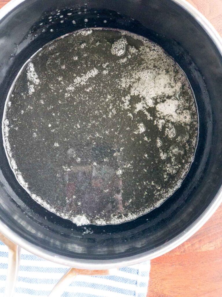Butter melted in a black bottom sauce pan