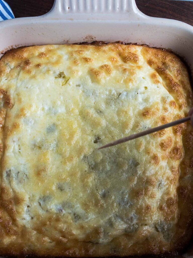 Testing the egg casserole with a toothpick