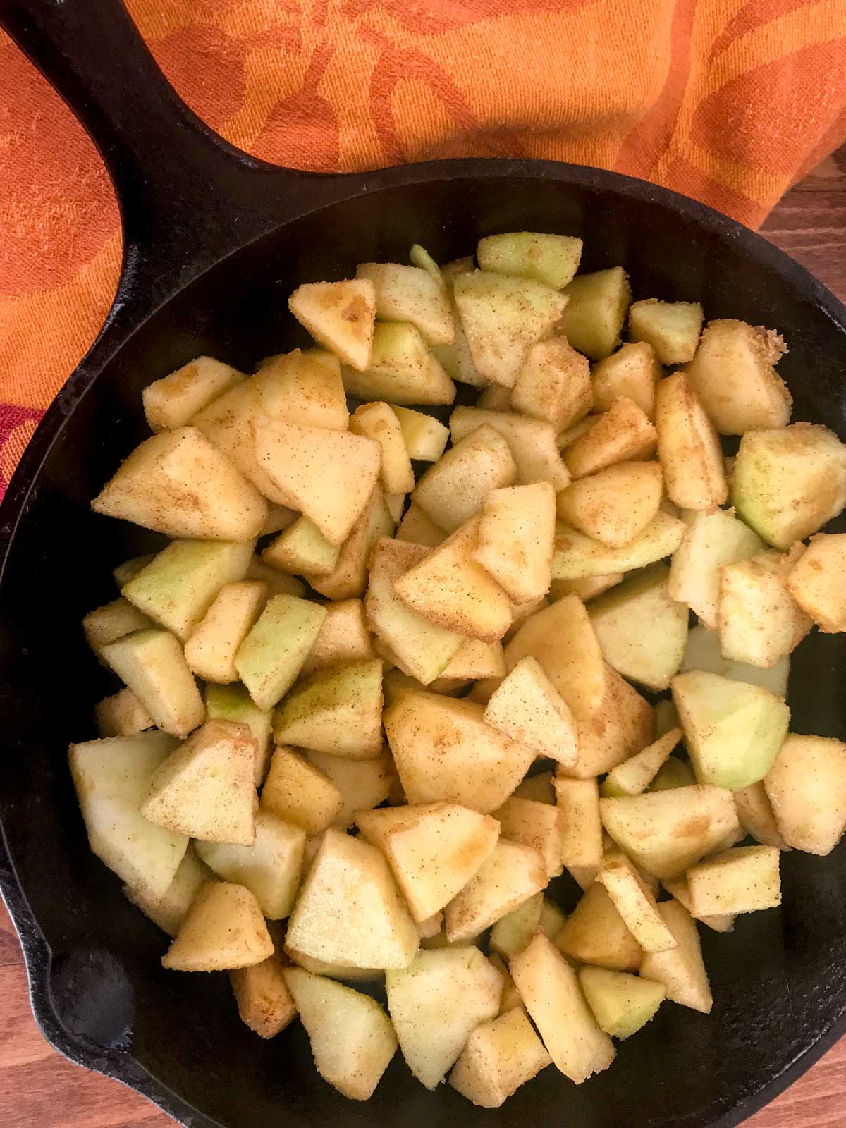 Diced apples in a cast-iron skillet