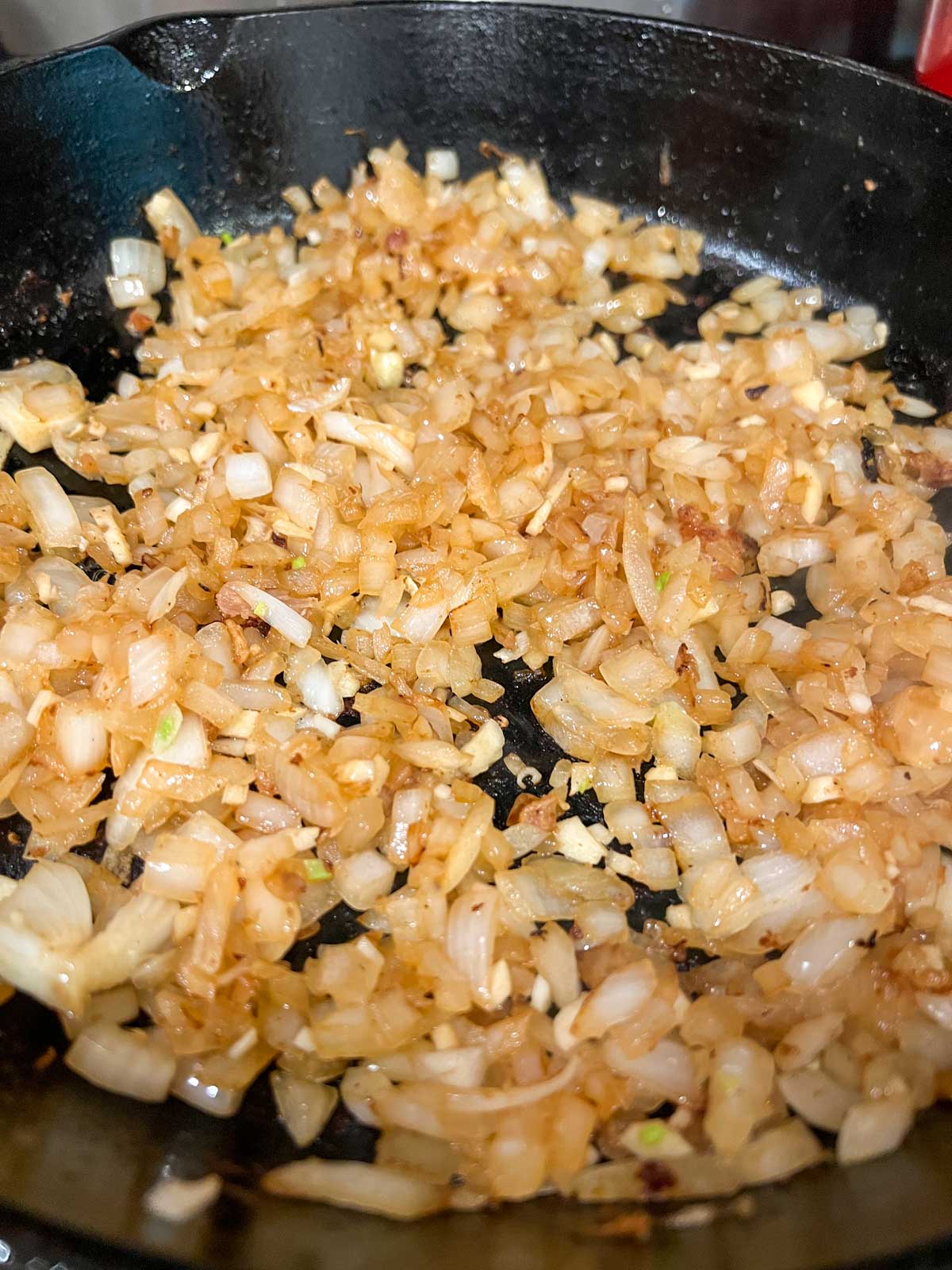 Sautéed diced onions in a Dutch oven