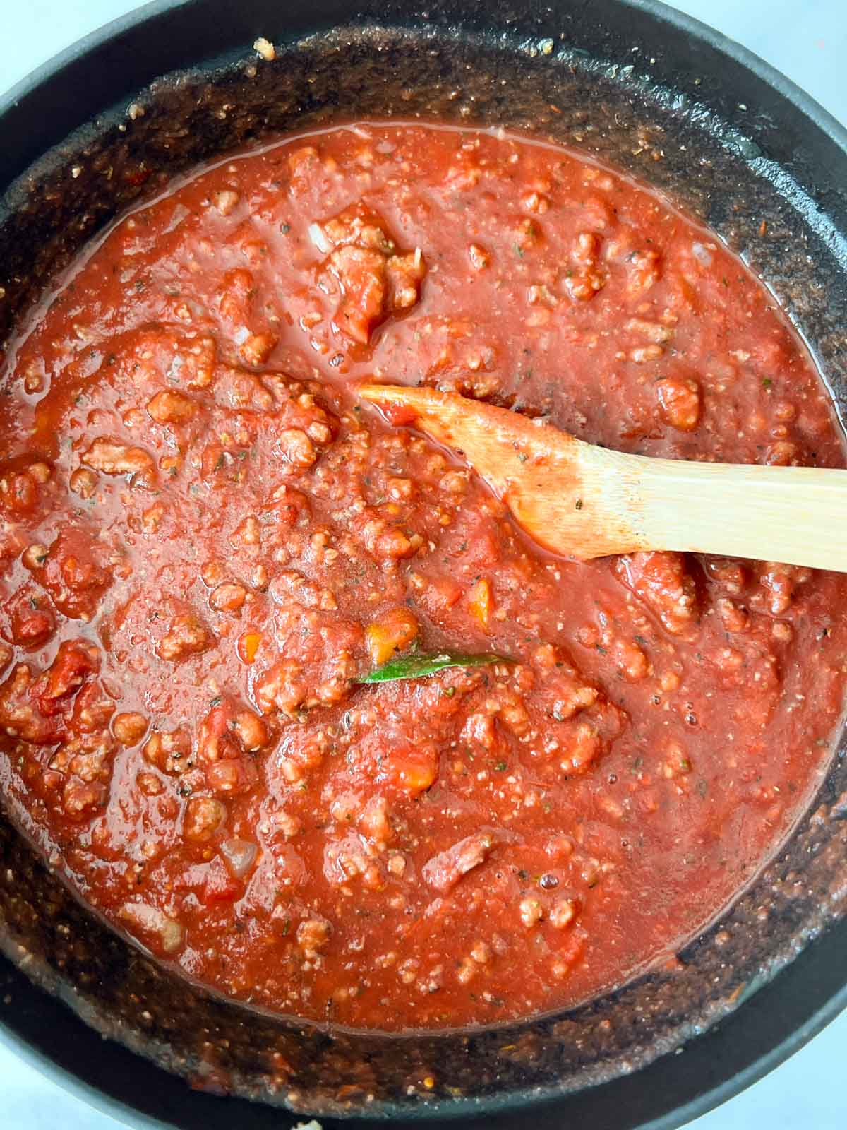 Spaghetti turkey meat sauce with all ingredients in a Dutch oven