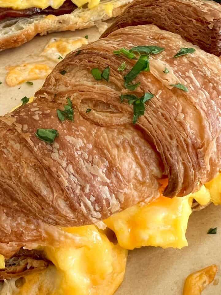 Breakfast Croissant Sandwich with Scrambled eggs, cheese and bacon