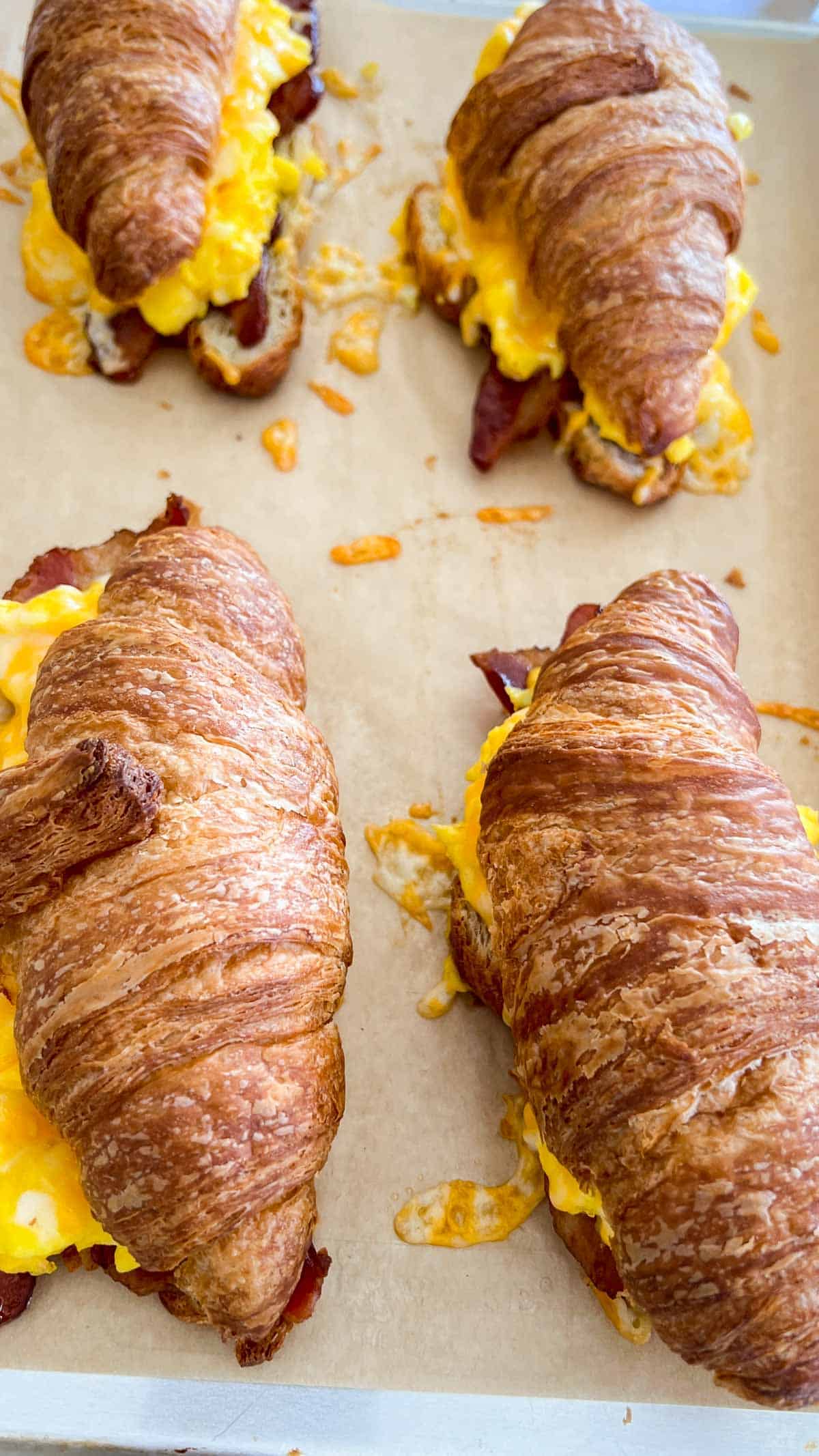 Baked Breakfast Croissant on sheet pan lined with parchment paper