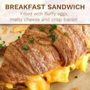 Breakfast Croissant Sandwich filled with bacon, scrambled eggs and cheese